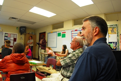 Scientists Jeff Meldrum (foreground) and Henner Fahrenbach observe the presentation as they sit among the students. Photograph by Chris Buntenbah.