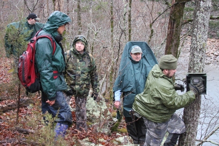 The team works to retrieve photographic data from at least a dozen Reconyx camera-traps. (Photo: Alex Diaz).