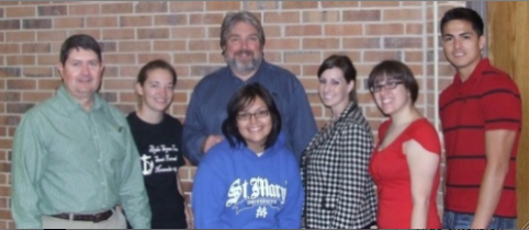 From left to right: Alton Higgins, Sarah Hundley, Thomas Woodruff, Katie O'Donnell, Kimberly Vela, and Manny Vasquez. In front wearing the St. Mary's sweatshirt is Maria Jimenez. Photo: Craig Woolheater.