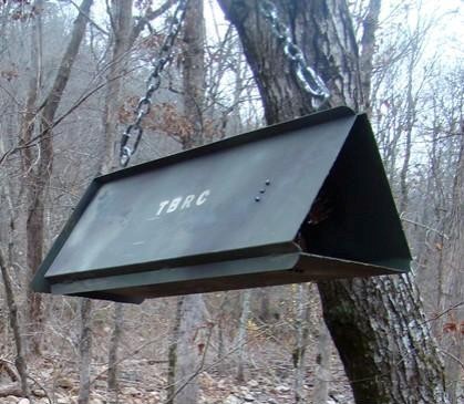 This experimental hair snare is designed to collect hair samples as an animal attempts to gain access to the bait placed inside by investigators; the inside walls are lined with a number of stiff steel brushes.