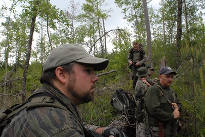 Chris Buntenbah, Paul Bowman, Mike Mayes, Travis Lawrence and Brad McAndrews find a dry log to rest on in Area Y, April 2007.