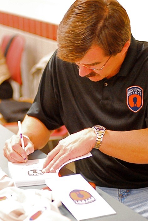 David Paulides signs books for buyers. Photo: Chris Buntenbah